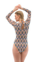 This file showcases sustainable tan-through smart swimsuits featuring the captivating Casablanca print. With a one-piece swimsuit design including sleeves, it offers chic silhouettes and signature cuts