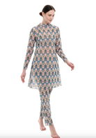 This file describes a tan-through, innovative, and sustainable burkini set with a Casablanca print. The set includes a top, leggings, and a tunic, providing classic luxury for modest fashion. The description also encourages people to shop for this stylish and eco-friendly swimwear.