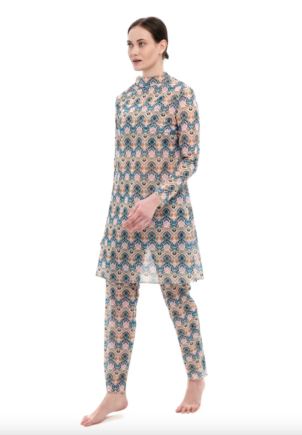 This file describes a tan-through, innovative, and sustainable burkini set with a Casablanca print. The set includes a top, leggings, and a tunic, offering classic luxury for modest fashion. The description also encourages people to shop for this stylish and eco-friendly swimwear.