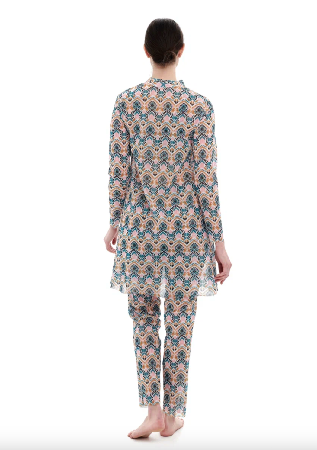 This file describes a tan-through, innovative, and sustainable burkini set with a Casablanca print. The set includes a top, leggings, and a tunic, offering classic luxury for modest fashion. It encourages people to shop for this stylish and eco-friendly swimwear.