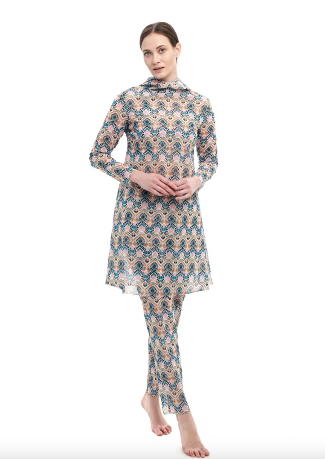 This file describes a tan-through, innovative, and sustainable burkini set with a Casablanca print. The set includes a top, leggings, and a tunic, offering classic luxury for modest fashion. The description also encourages people to shop for this stylish and eco-friendly swimwear.