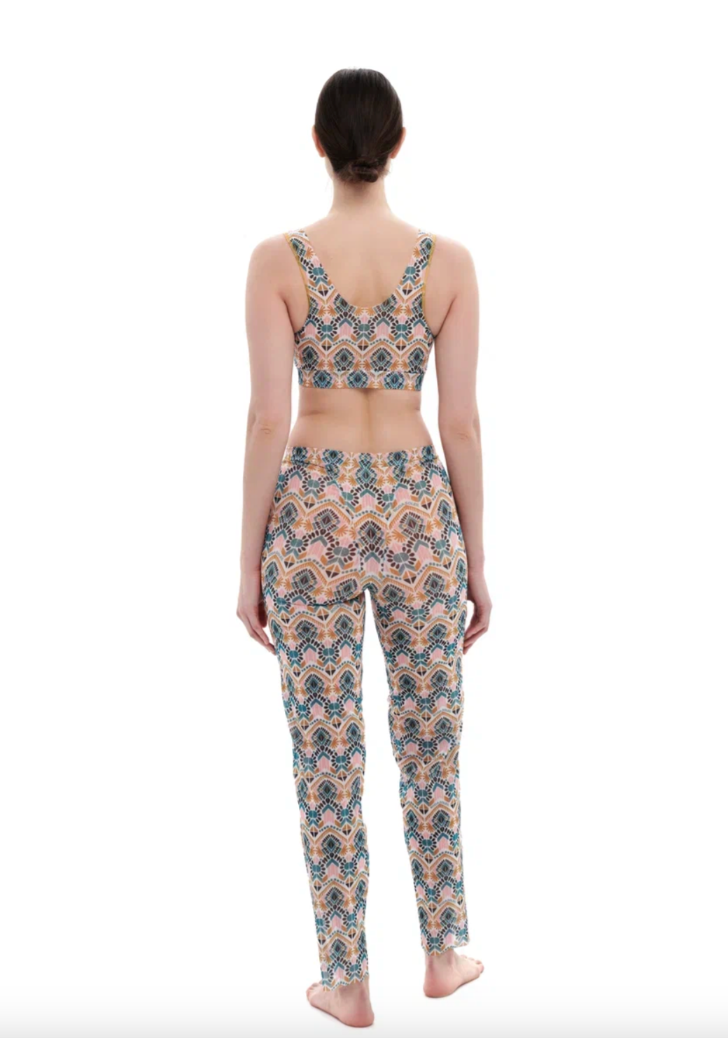 This file describes a tan-through, innovative, and sustainable burkini set with a Casablanca print. The set includes a top, leggings, and a tunic, offering classic luxury for modest fashion. The description also encourages people to shop for this stylish and eco-friendly swimwear.