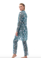 This file contains a description of a sustainable, tan-through burkini set with an Irises print. It includes a top, leggings, and tunic, offering classic luxury for modest fashion. Shop now!