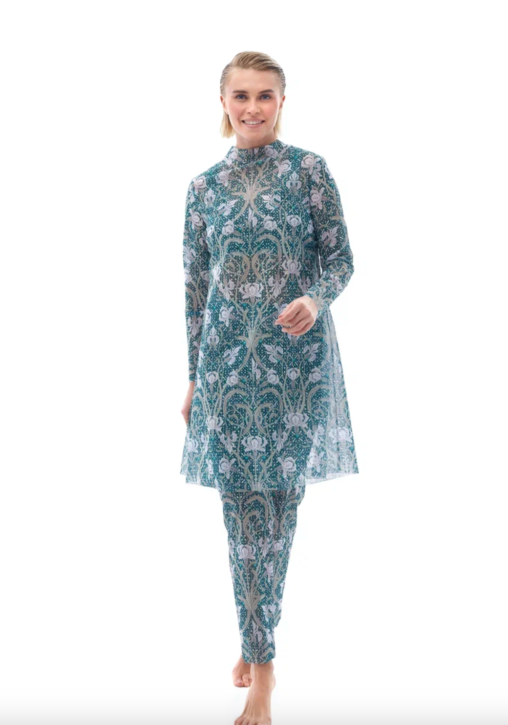 This file describes a sustainable, tan-through burkini set with an Irises print. It includes a top, leggings, and tunic, offering classic luxury for modest fashion. Shop now!