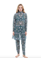 This file describes a tan-through, sustainable burkini set with an Irises print. The set includes a top, leggings, and tunic, offering innovative classic luxury for modest fashion. Shop now!