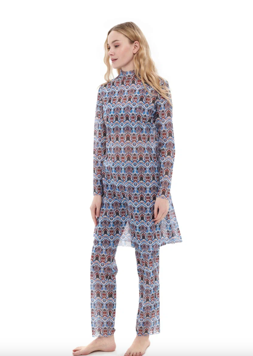 This file contains a description of a tan-through, sustainable burkini set with a Marrakesh print. It includes a top, leggings, and tunic, offering innovative classic luxury for modest fashion. Shop now!