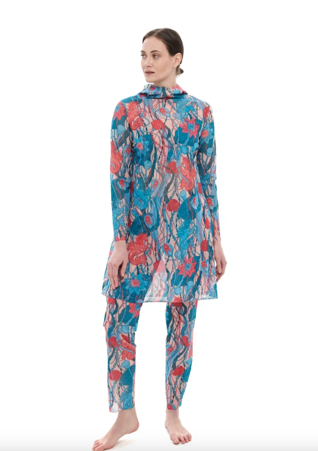 This file contains a description of a tan-through burkini set with a Seaunicorns print. The set includes a top, leggings, and tunic, offering innovative, sustainable, classic luxury for modest fashion. Shop now!