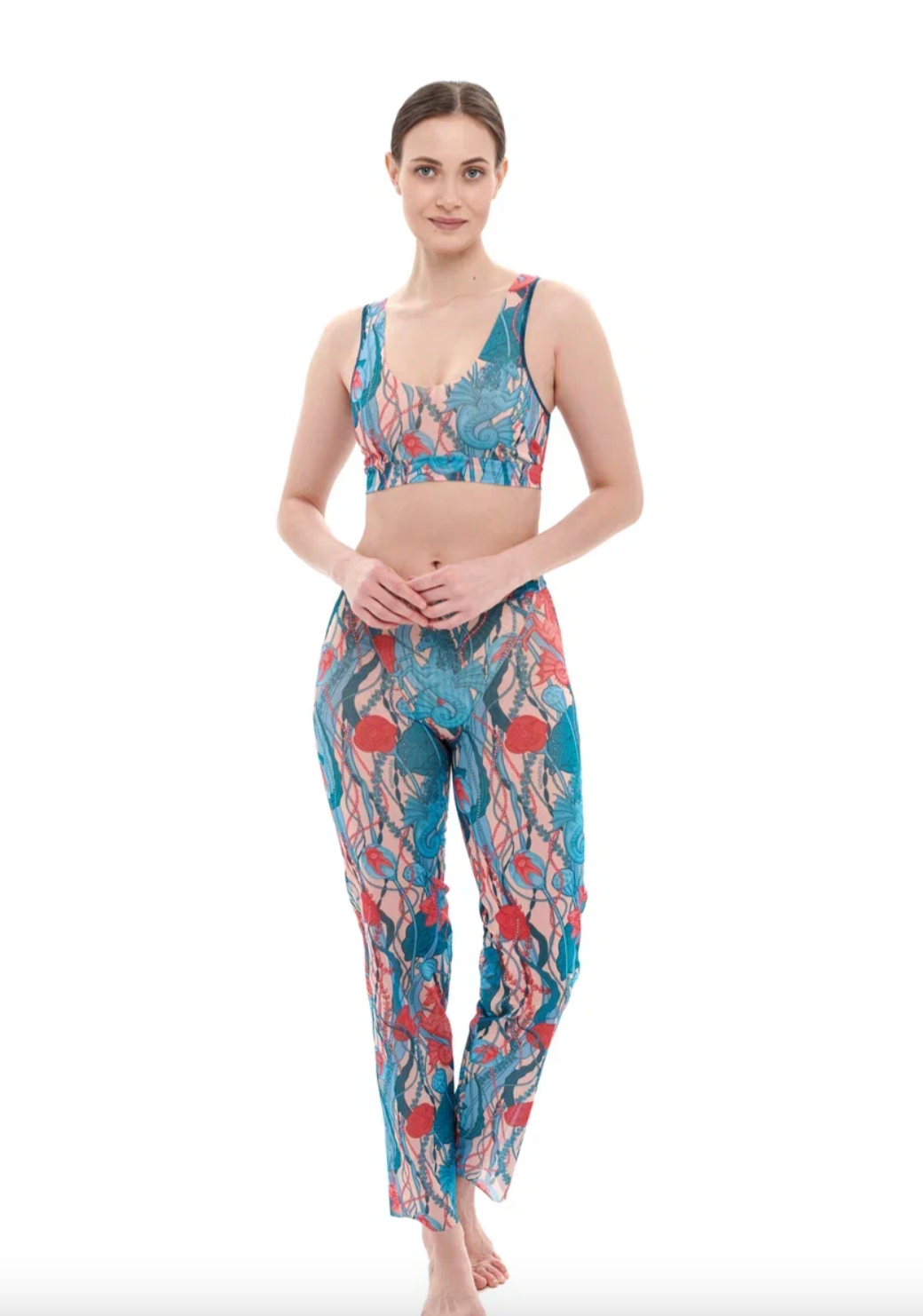 This file describes a tan-through burkini set with a Seaunicorns print. The innovative, sustainable set includes a top, leggings, and tunic, offering classic luxury for modest fashion. Shop now!