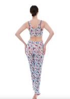 This file contains a description of a tan-through burkini set with a Strelitzia print. The set includes a top, leggings, and tunic, offering innovative, sustainable, classic luxury for modest fashion. Shop now!