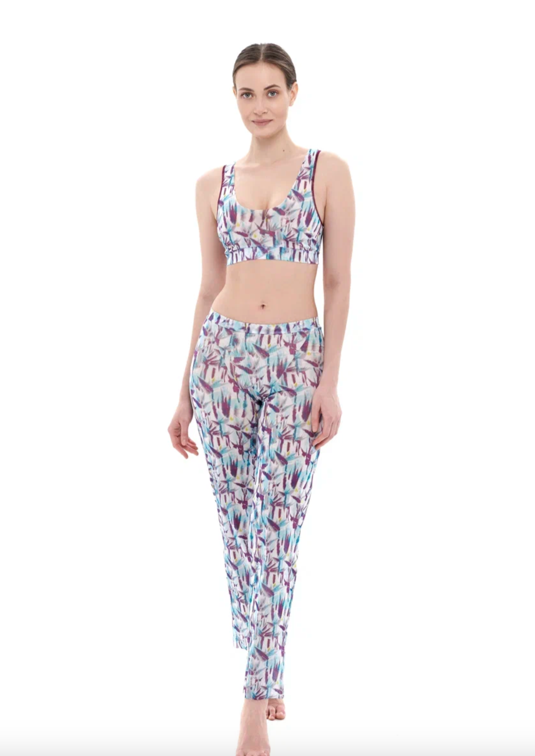 This file describes a tan-through, sustainable burkini set with a Strelitzia print. It includes a top, leggings, and a tunic, providing innovative, classic luxury for modest fashion. Shop now!