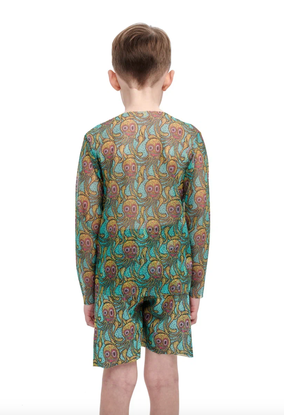 This file describes a tan-through, sustainable kid's T-shirt and shorts set with an Octopus print. It combines innovation and classic luxury for modest fashion. Shop now!