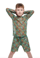 This file contains a description of a tan-through kid's T-shirt and shorts set with an Octopus print. It is innovative, sustainable, and offers classic luxury for modest fashion. Shop now!