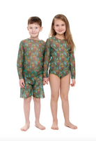 This file describes a sustainable, tan-through kid's T-shirt and shorts set with an Octopus print. It combines classic luxury and modest fashion. Shop now!