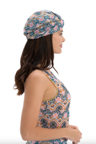 This file contains a description of a CASABLANCA print Turban that is tan-through, innovative, and sustainable. One size fits all, providing classic luxury for modest fashion. Includes a call to action to shop now for stylish, eco-friendly elegance and sun protection.