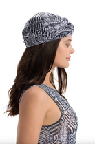 This file contains a description of a one-size-fits-all FAKE ZEBRA print turban. It offers classic luxury for modest fashion and includes a call to action to shop now for elegant, eco-friendly headwear.