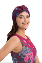 This file describes the PEONIES print turban, which is one size fits all. It combines fashion and function, providing classic luxury for modest fashion. Encourages shopping now for stylish, eco-friendly headwear.