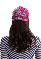 This file describes the STRIPES print turban, featuring a one-size-fits-all design. It blends classic luxury and modest fashion. Encourages shopping now for stylish, eco-friendly headwear.