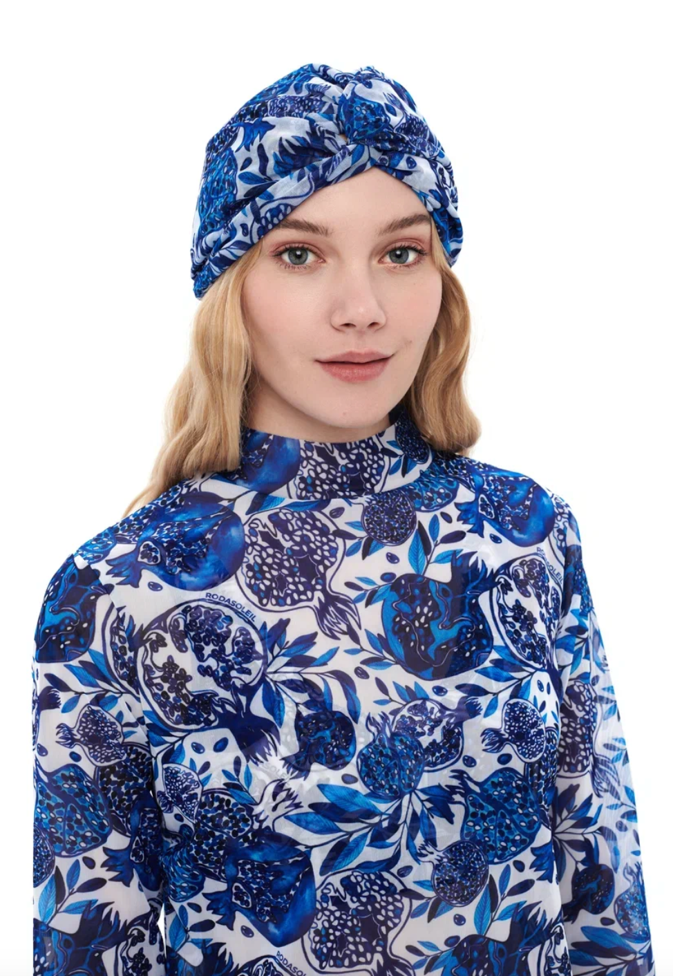 This file contains a description of a one-size-fits-all POMEGRANATE print turban. It offers classic luxury for modest fashion and includes a call to action to shop now for elegant, eco-friendly headwear.