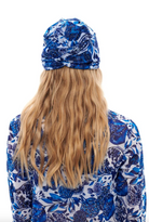 This file describes the POMEGRANATE print turban, featuring a one-size-fits-all design. It blends classic luxury and modest fashion. Encourages shopping now for stylish, eco-friendly headwear.