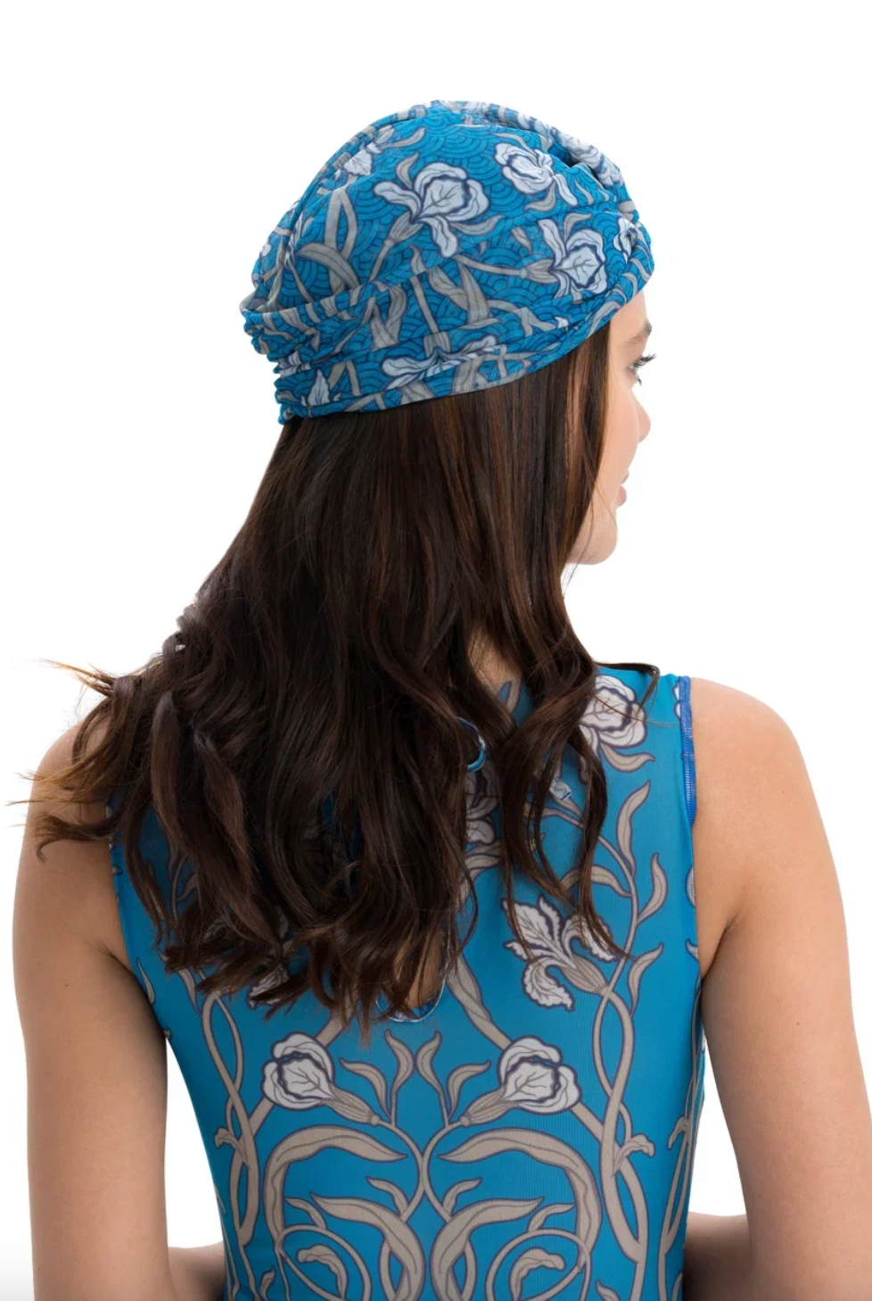 This file contains a description of a one-size-fits-all SWANS print turban. It offers classic luxury for modest fashion and includes a call to action to shop now for elegant, eco-friendly headwear.