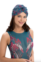 This file contains a description of the SWANS print turban, one size fits all. It offers classic luxury for modest fashion and includes a call to action to shop now for elegant, eco-friendly headwear.