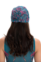 This file describes the SWANS print turban, featuring a one-size-fits-all design. It blends classic luxury and modest fashion. Encourages shopping now for stylish, eco-friendly headwear.