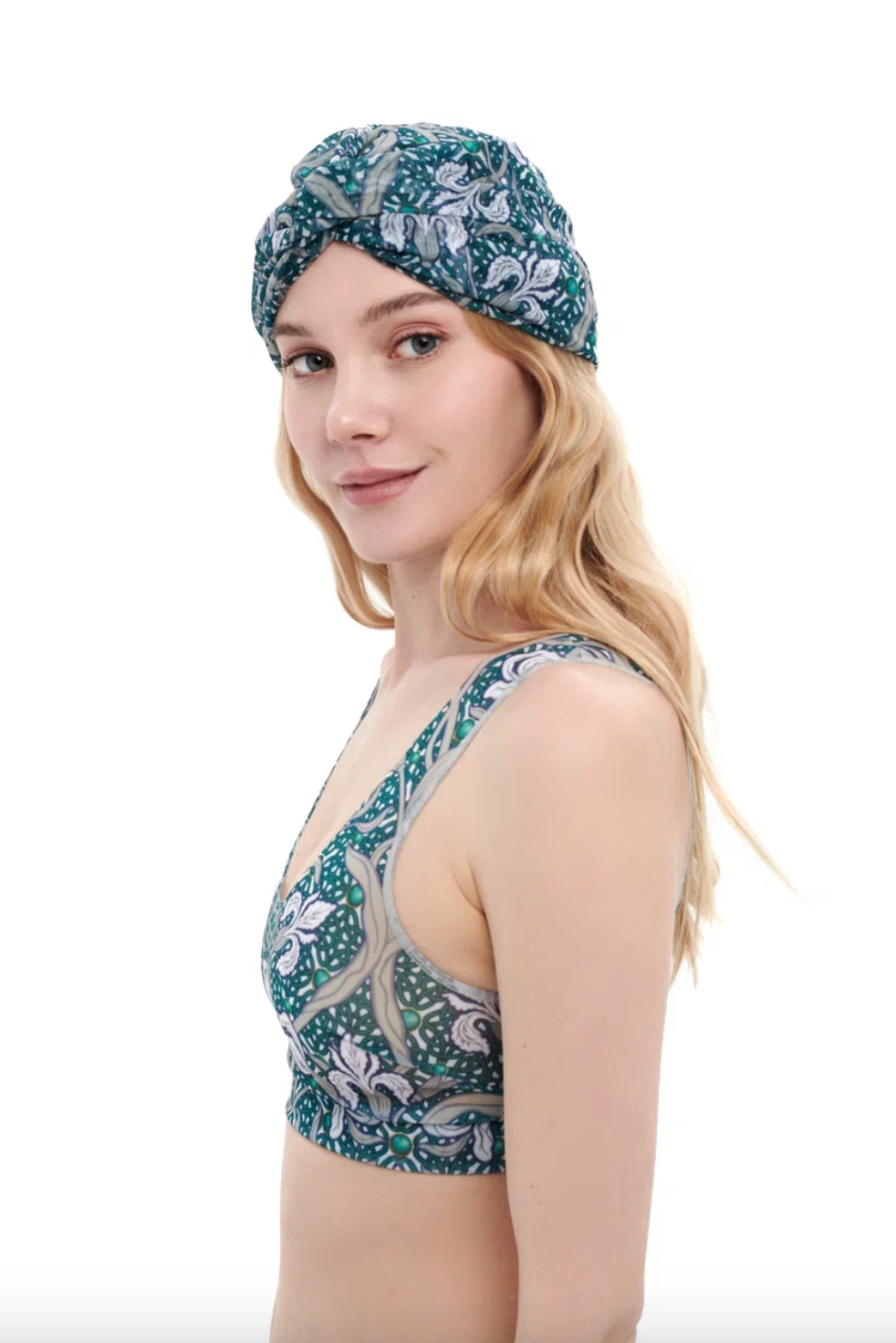 This file describes the IRISES print turban, featuring a one-size-fits-all design. It blends classic luxury and modest fashion. Encourages shopping now for stylish, eco-friendly headwear.