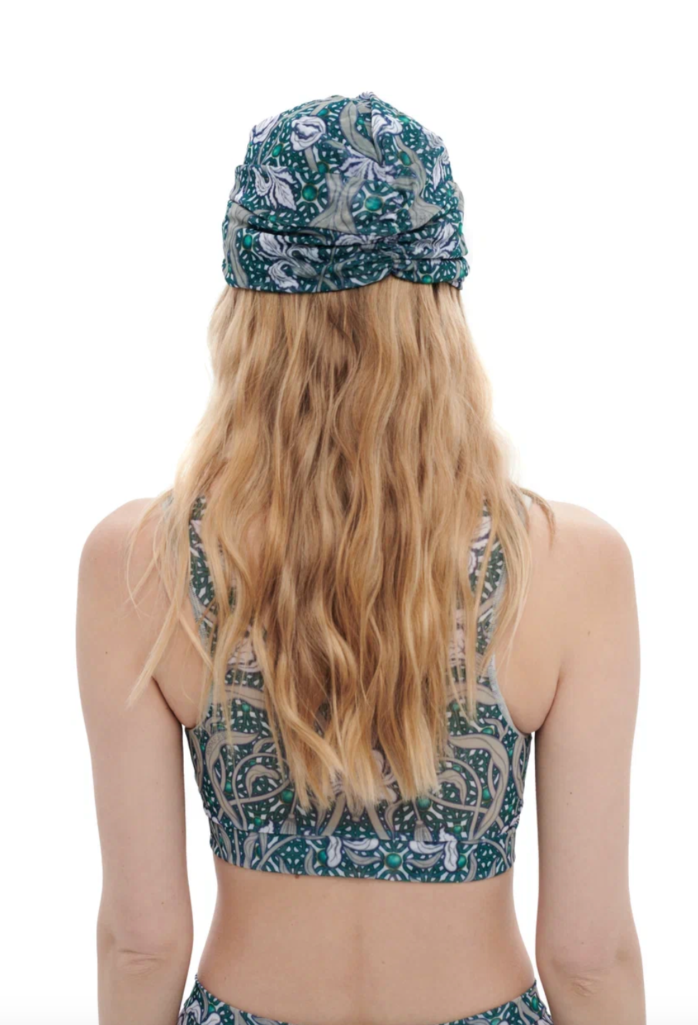 This file contains a description of the IRISES print turban, one size fits all. It offers stylish, eco-friendly headwear and includes a call to action to shop now for classic luxury for modest fashion.