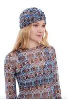 This file describes the MARAKKESH print turban, featuring a one-size-fits-all design. It blends classic luxury and modest fashion. Encourages shopping now for stylish, eco-friendly headwear.